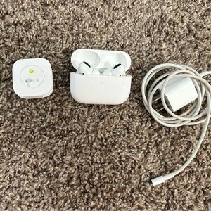 Apple Airpods Pro Model A2084 with charging case, charging cord, and 3 size buds